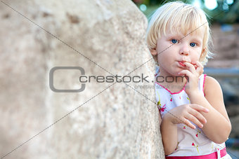 surprised girl by the stone
