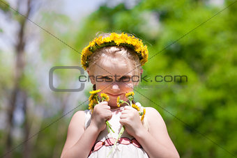 small beauty with dandelions