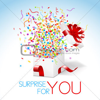 White opened box with red ribbon and flying confetti