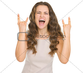 Young woman rock gesturing
