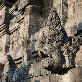 Carved drain at Borobudur temple on Java, Indonesia