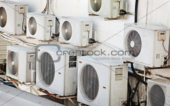 Many older air conditioners on the wall