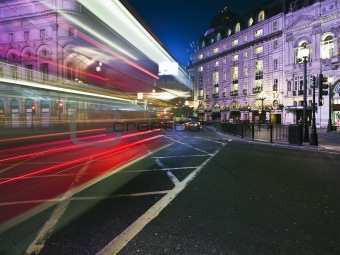 Speed blur of London bus in piccadilly circus at night 