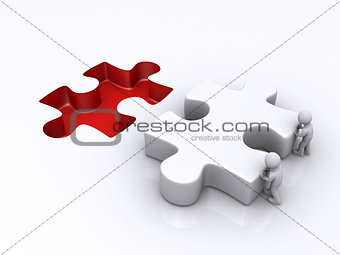 Two persons are pushing last puzzle piece