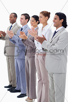Business people smiling and applauding 