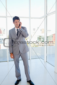 Stern executive on the phone in a bright room