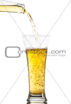 Glass of beer being poured from a bottle