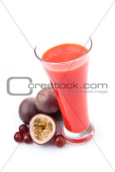 Full glass near passion fruits