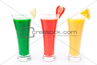 fruit pieces in a row of glasses