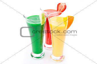 Fruit pieces in three full glasses