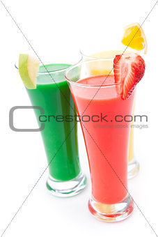 Three full glasses with fruit pieces