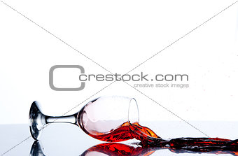 Glass on the floor with a red trickle flowing
