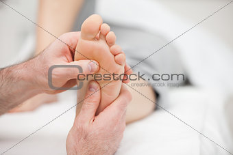 Patient receiving a foot massage