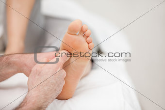 The side of a foot being massaged