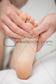 Foot being touched by a chiropodist
