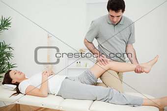 Peaceful brunette woman lying on a medical table