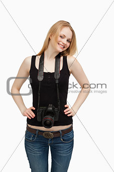Smiling woman carrying a camera