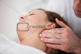 Close-up of woman being massaging by a physiotherapist