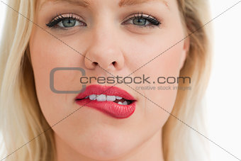 Attractive blonde woman biting her lips