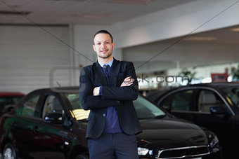 Man standing in front of a car