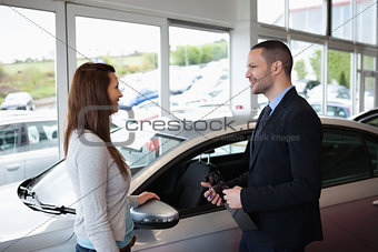 Dealer speaking to a client
