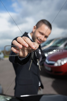 Happy businessman holding car keys