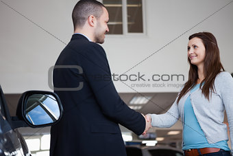 Salesman shaking hand of a client