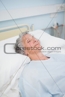 Patient sleeping on a bed