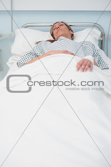 Woman sleeping on a bed