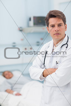Doctor crossing arms while standing