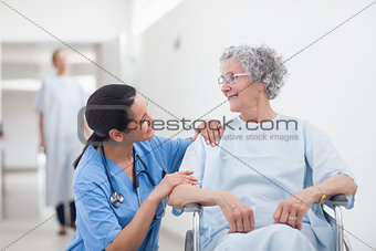 Elderly patient looking at a nurse