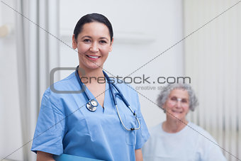 Nurse and a patient looking at camera