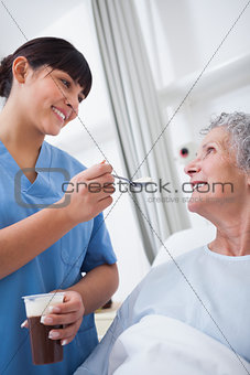 Nurse feeding a patient