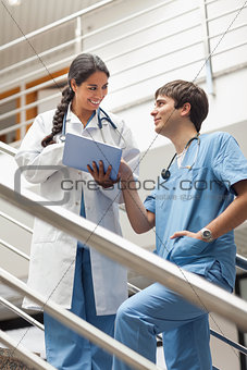 Doctor and a male nurse talking