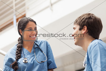 Female nurse talking with a male nurse