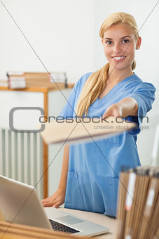 Nurse giving a folder