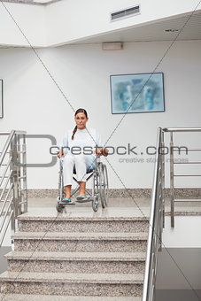 Female patient sitting on a wheelchair