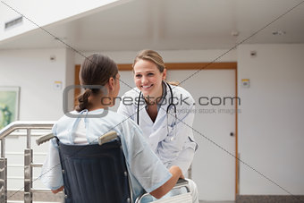 Doctor in front of a patient on a wheelchair