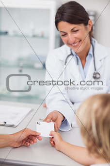 Female doctor giving a prescription