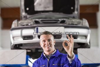 Mechanic doing a gesture with his fingers