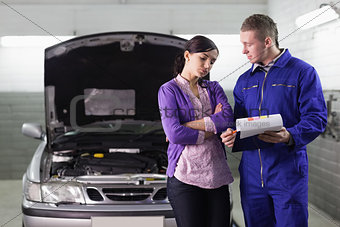 Mechanic showing the quotation to a client
