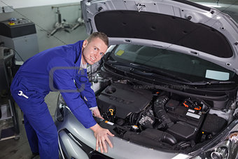 Mechanic repairing an engine of car