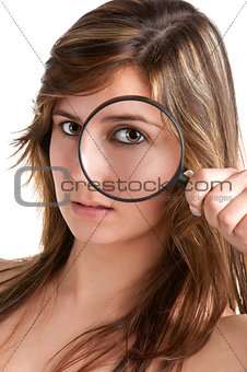 Woman looking trough a loupe