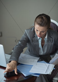 Business woman working in hotel room