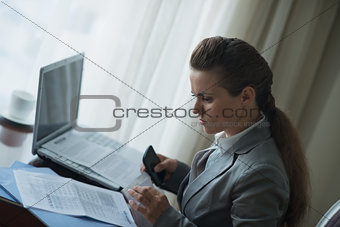 Business woman working in hotel room