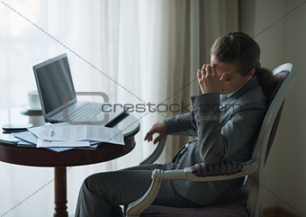 Stressed business woman working in hotel room