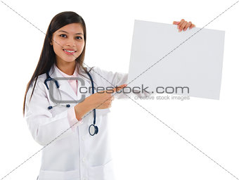 Medical doctor showing white blank placard