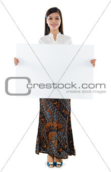 Southeast Asian woman holding a white blank card