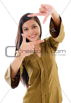 Southeast Asian Muslim female making a frame with fingers
