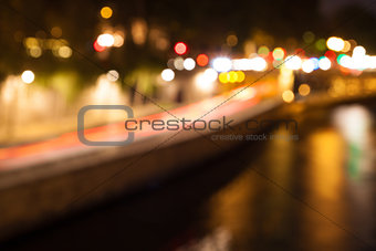 Bokeh of city lights with reflections in a river